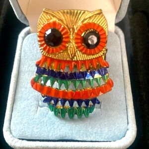 A vintage multicolored owl with black rhinestone eyes stretchy ring.